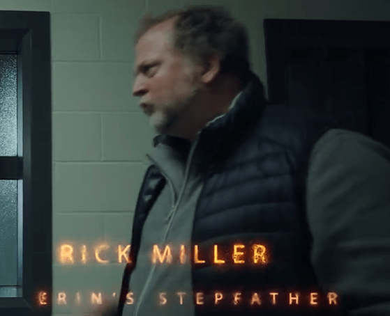A man named Rick Miller, identified as Erin's stepfather, appears to be in a tense moment in a dimly lit hallway with a door in the background.