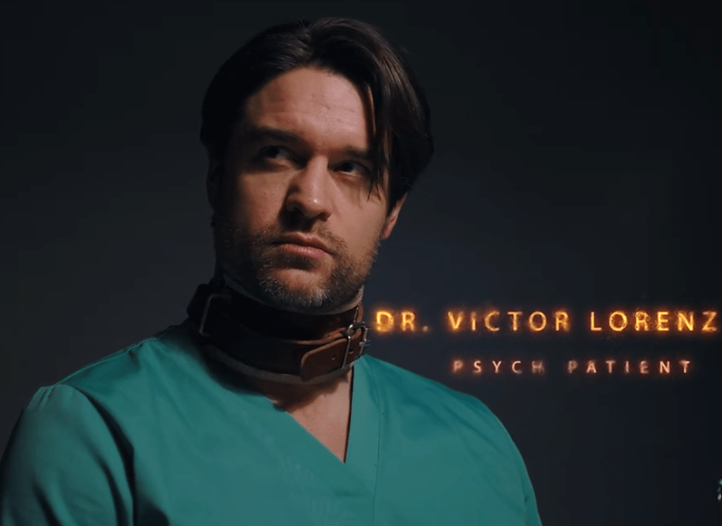 A man in surgical scrubs with a serious expression, wearing a neck restraint, seated against a dark background, with text identifying him as Dr. Victor Lorenz, a psych patient.
